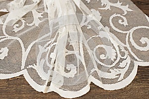 Close up of Beautiful White Tulle. Sheer Curtains Fabric Sample. Texture, Background, Pattern. Wedding Concept. Interior Design. V