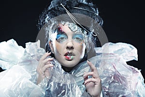 Close-up of beautiful woman face with creative fashion art make