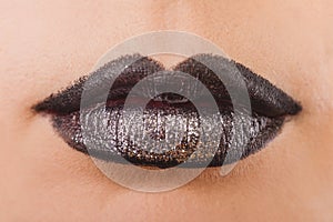 Close up of beautiful woman face portrait with tinsel makeup