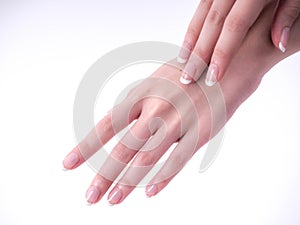 Close up of beautiful Woman Hands. Spa and Manicure concept. Female hands with french manicure. Soft skin, skincare concept.