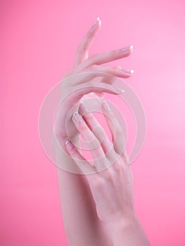 Close up of beautiful Woman Hands. Spa and Manicure concept. Female hands with french manicure. Soft skin, skincare concept.