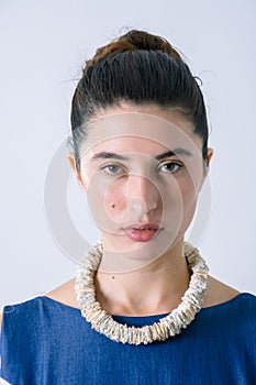 Close up of a beautiful woman portrait with paper necklace