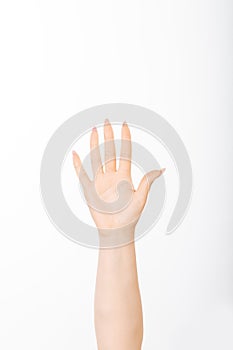 Close-up of beautiful woman`s hand isolated on white background