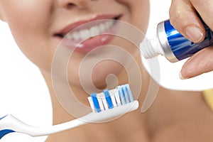 A close up of a beautiful woman with toothbrush