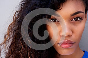 Close up beautiful young african american woman staring