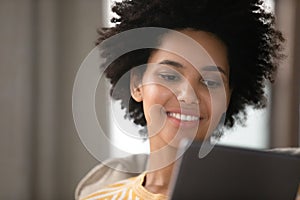 Close up beautiful young african american woman using digital tablet.