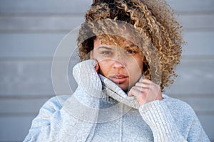 Close up beautiful young african american woman in warm sweater