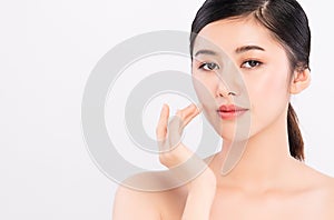 Close up Beautiful Young asian Woman touching her clean face with fresh Healthy Skin, on white background, Beauty Cosmetics and