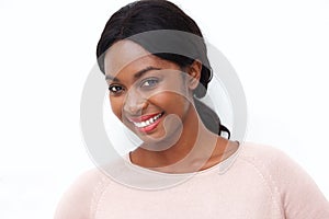 Close up beautiful young black woman smiling against isolated white background