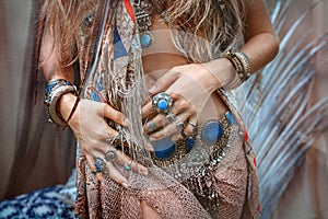 Close up of beautiful young gypsy style woman with lots of accessories