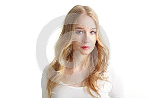 Close-up of a beautiful young woman smiling on white background