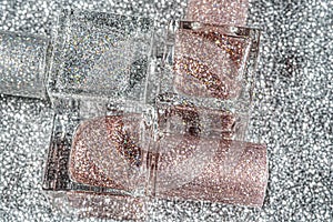 Close-up beauty. Bottles nail polish rotates on a black background