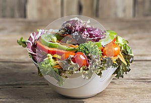 Close-up The Beauty of Colorful and Healthy Salads on wooden tab