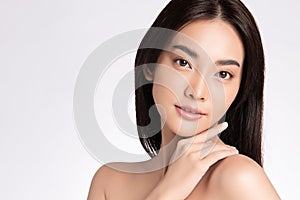 Close up Beauty face. Smiling asian woman touching healthy skin portrait. Beautiful happy girl model with fresh glowing hydrated