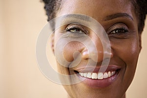 Close Up Beauty Portrait Of Smiling Mature Woman Against Natural Background