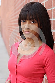 Close up beauty portrait of a young and attractive African American black woman with perfect skin, with toothless smile
