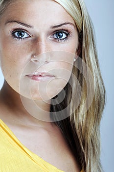 Close-up beauty portrait of a young blond woman