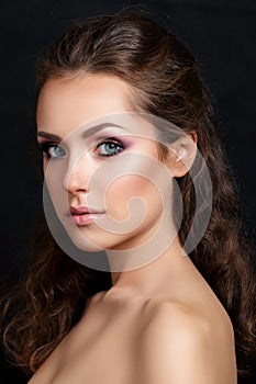 Close-up beauty portrait of young pretty brunette photo