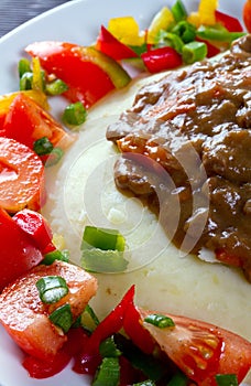 Close up of beef goulash with salad