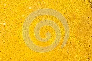 Close up of beer bubbles and foam as a background