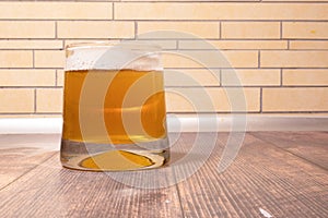 Close-up of beer bubbles with foam in a glass glass . Light beer on a white background