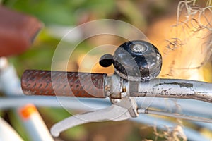 a bell attached to a vintage bicycle handlebar