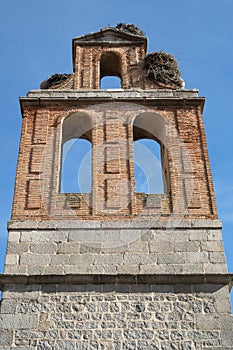Close-up of the bell gable with bird nest at the Ruins of the college of San JerÃÂ³nimo in ÃÂvila, Spain photo