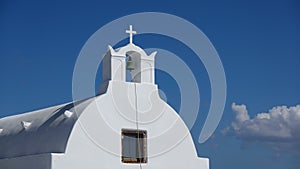 Close up of bell, white church in Oia Santorini, Greece