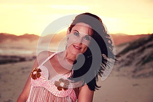 Close-up of belly dancer on agolden beach