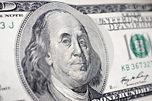 The close-up of Benjamin Franklin's face on the 100 dollar bill