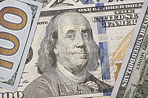 Close up of Benjamin Franklins face on US 100 dollar bill.