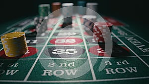 Close up of bet stacks of chips on a green casino roulette table. Concept of gambling or poker betting and entertainment