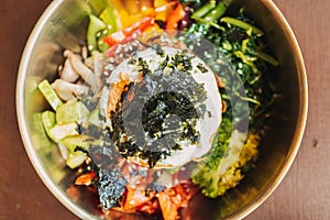 Close up of Bibimbap or Korean rice dish served on table.