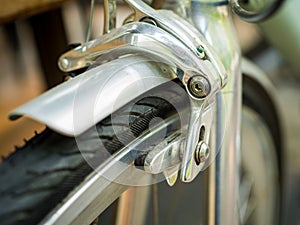 Close-up bicycle brakes and wheel on vintage bicycle