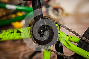 Close up of Bicycle pedal fixed by a mechanic in a workshop, in blurred background photo