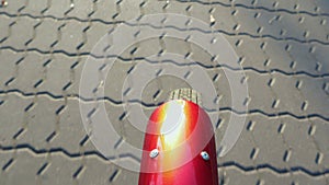 Close-up of a Bicycle wheel rolling on the pavement slab
