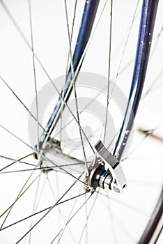 Close up of bicycle wheel with spokes and fork