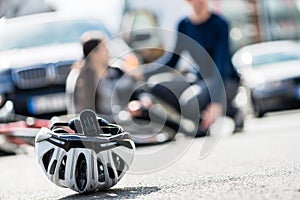 Close-up of a bicycling helmet fallen down on the ground after a photo