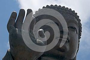 Close-up of Big Buddha hand and face