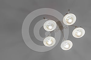 a close up big home light chandelier against the ceiling view at home, minimalist style