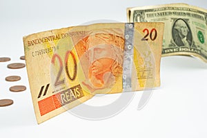 Close up of a bill of 20 Brazilian reals and one US dollar bil