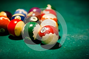 Close up of billiard table with balls in entertainment club