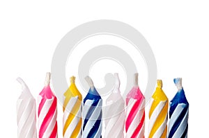 Close up of birthday candles on white