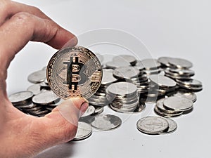 Close up hand holding bitcoin  on white blackground