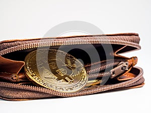 Close up bitcoin gold coins with wallet on the white background. Virtual cryptocurrency concept