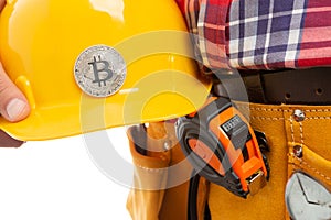 Close-up bitcoin on hardhat