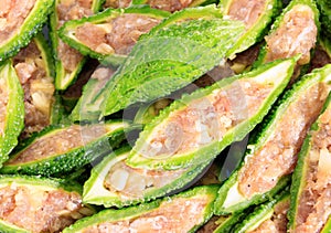 Close up bitter gourd pile with stuffed hack pork and garlic black pepper ingredient. vegetable herb Nourish the health body