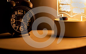 Close-up of a black alarm clock at 01:00 AM, early morning