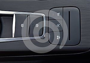 Close-up of black buttons on car panel