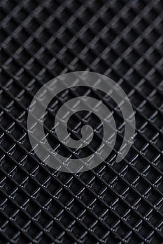 Close up of a black carbon fiber as a background. Macro.